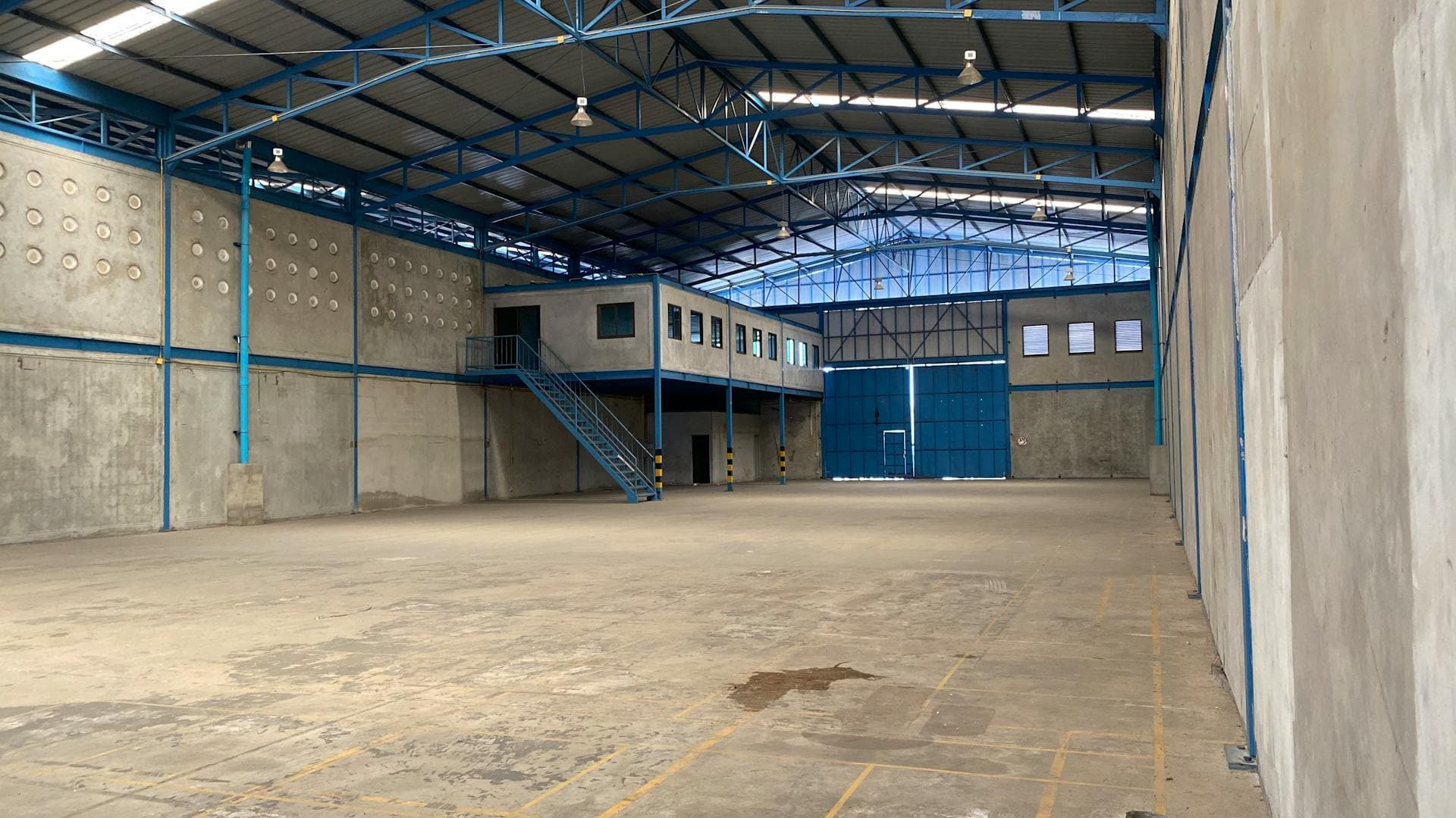 Industrial warehouse with steel frame shelving — furniture that holds up